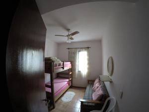 Una cama o camas en una habitación de Ubatuba-Praia Grande
