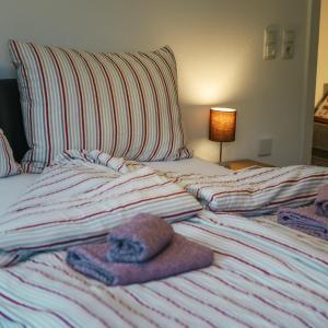Posteľ alebo postele v izbe v ubytovaní Siegi's Apartments