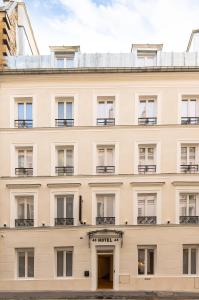 a large building with a large window at HOTEL AU COEUR DE REPUBLIQUE in Paris
