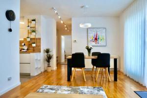 a dining room with a table and chairs at Apartment Zen in Sveta Nedjelja