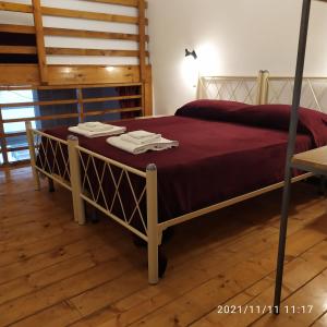 Posteľ alebo postele v izbe v ubytovaní Il Castello Apartment