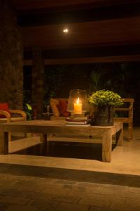 a coffee table with a candle on a patio at Stone House, Kandy in Kandy +38 photos