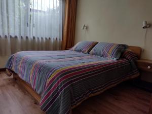 Ένα ή περισσότερα κρεβάτια σε δωμάτιο στο Cabañas Amancay