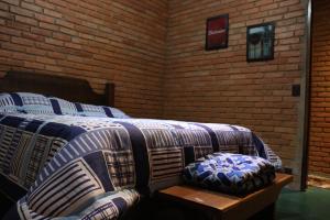 Llit o llits en una habitació de Casa de campo, próximo ao parque Nacional do Itatiaia
