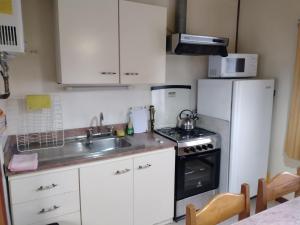 Η κουζίνα ή μικρή κουζίνα στο Cabañas Amancay