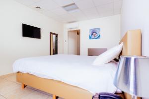 Postelja oz. postelje v sobi nastanitve Hotel Soret