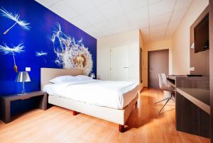 Postelja oz. postelje v sobi nastanitve Hotel Soret