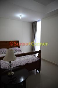 Postel nebo postele na pokoji v ubytování Sunset Corner @Pollux Habibie