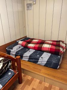 Кровать или кровати в номере Komei Container Homestay