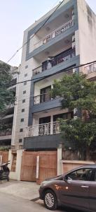 a car parked in front of a building at Hostmystay- 3Bhk Terrace! Gk1 M block in New Delhi