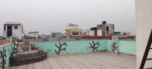 a view of a city from the roof of a building at Hostmystay- 3Bhk Terrace! Gk1 M block in New Delhi