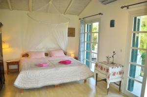 Postel nebo postele na pokoji v ubytování House Lemoni, Apartment A with Terrace and balcony - Pelekas, Corfu