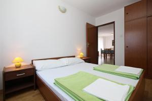 Posteľ alebo postele v izbe v ubytovaní Apartments Mohar II