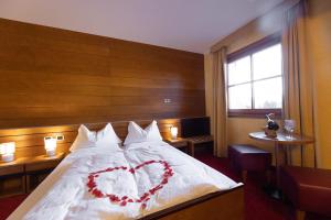 Postel nebo postele na pokoji v ubytování Hotel Enzo Moro