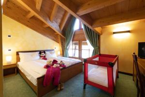 Postel nebo postele na pokoji v ubytování Hotel Enzo Moro