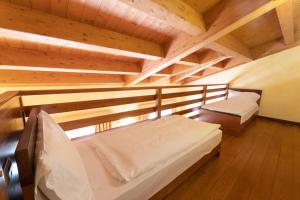 Postel nebo postele na pokoji v ubytování Hotel Enzo Moro