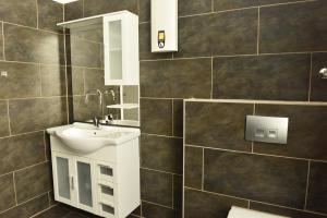a bathroom with a sink and a mirror at Fewo Wuppertal in Wuppertal +183 photos