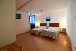 a hospital room with two beds and a window at GITE DES MOINES-Canelle in Canari
