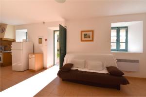 a bedroom with a bed in the middle of a kitchen at GITE DES MOINES-Canelle in Canari
