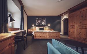 Postel nebo postele na pokoji v ubytování Hotel Davoserhof by Mountain Hotels