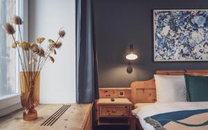 Postel nebo postele na pokoji v ubytování Hotel Davoserhof by Mountain Hotels
