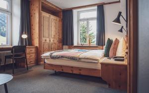 Postel nebo postele na pokoji v ubytování Hotel Davoserhof by Mountain Hotels