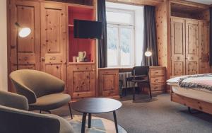 Postel nebo postele na pokoji v ubytování Hotel Davoserhof by Mountain Hotels