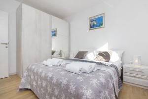 Posteľ alebo postele v izbe v ubytovaní Apartments Luka