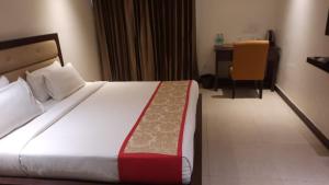 Postel nebo postele na pokoji v ubytování Zenith Hotel - Delhi Airport