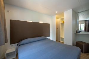 Postel nebo postele na pokoji v ubytování Camping Porto srl