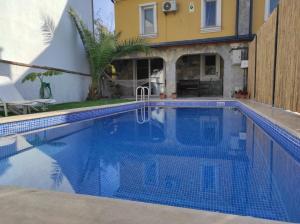 a swimming pool in front of a house at Villa SD Sapanca in Sapanca