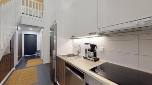 a kitchen with a sink and a counter top at Starvillas A302 in Kalajoki