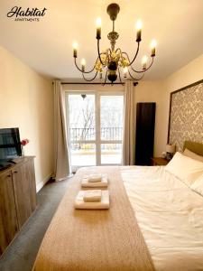 Postel nebo postele na pokoji v ubytování habitat Holiday Apartment