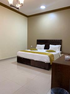 Postel nebo postele na pokoji v ubytování فندق ليالي العرب