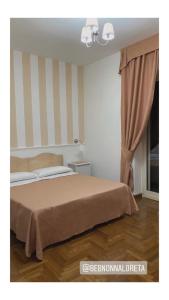 Postel nebo postele na pokoji v ubytování Bed and Breakfast Nonna Loreta