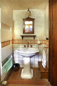 a bathroom with a sink and a mirror at Mountain Dreams House - Stunning view over Lake Jasna! in Kranjska Gora