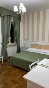 Postel nebo postele na pokoji v ubytování Bed and Breakfast Nonna Loreta