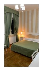 Postel nebo postele na pokoji v ubytování Bed and Breakfast Nonna Loreta