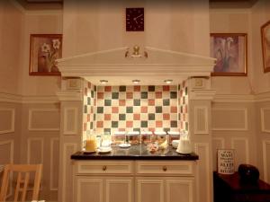 a kitchen with a counter with dishes on it at Athol House in Filey