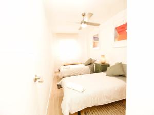 Łóżko lub łóżka w pokoju w obiekcie Apartamento Aliaga