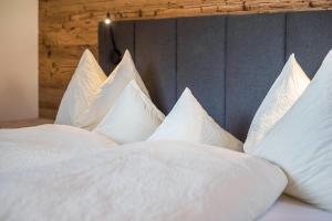 A bed or beds in a room at Leierhof Olivia