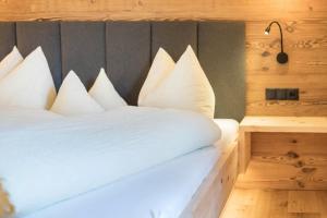 A bed or beds in a room at Leierhof Olivia