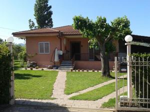 a house with a gate in front of it at Lovely cottage with garden !!!!! in Kariá