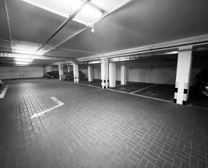 a black and white photo of an empty parking garage at Platinum Apartments Aparthotel in Poznań