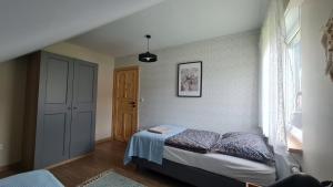 Postel nebo postele na pokoji v ubytování Załakowo, Na Gwizdówce 11 + 19 fotografií