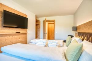 Postel nebo postele na pokoji v ubytování HUS23 with Wellness