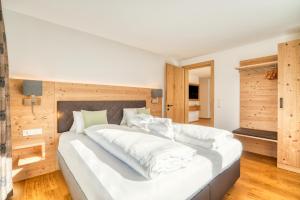 Postel nebo postele na pokoji v ubytování HUS23 with Wellness