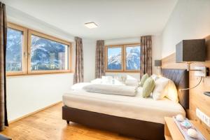 Postel nebo postele na pokoji v ubytování HUS23 with Wellness