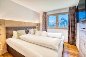 Postel nebo postele na pokoji v ubytování HUS23 with Wellness