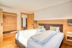 Postel nebo postele na pokoji v ubytování HUS23 with Wellness